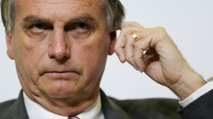 FILE PHOTO: Federal deputy Jair Bolsonaro, a pre-candidate for Brazil's presidential election, attends a presidential debate in Brasilia